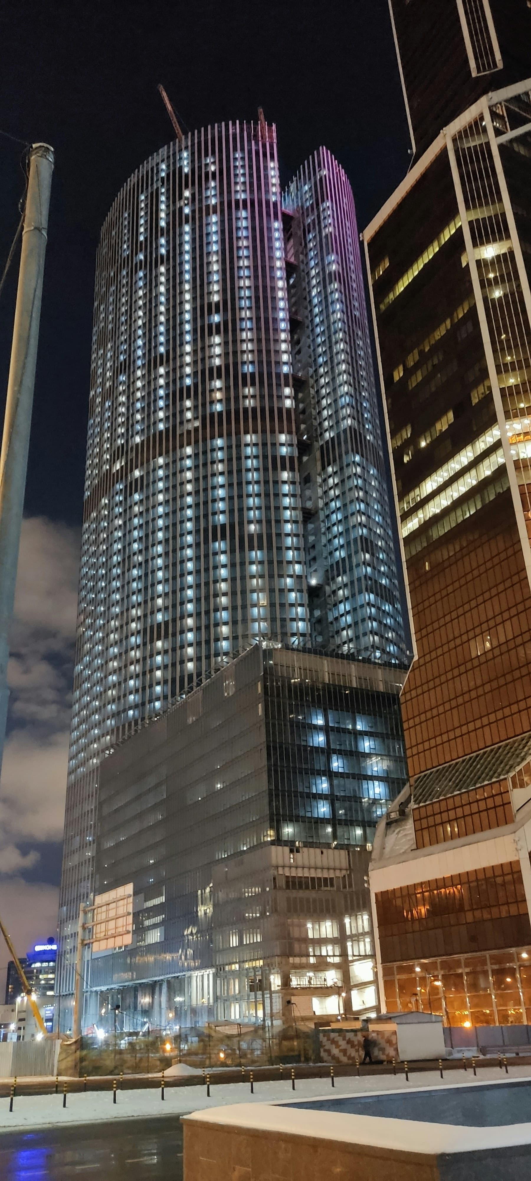 Petronas Twin Towers and Kuala Lumpur skyline at night with glowing lights